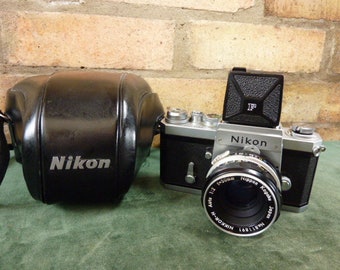 a Nice Nikon F  35MM SLR camera Waist Level finder 1:2  50mm lens & case