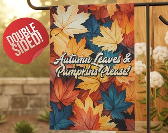 May include: Double-sided garden flag with a fall theme. The flag features a colorful pattern of autumn leaves in shades of orange, red, yellow, and blue. The text "Autumn Leaves & Pumpkins Please!" is printed on the flag.