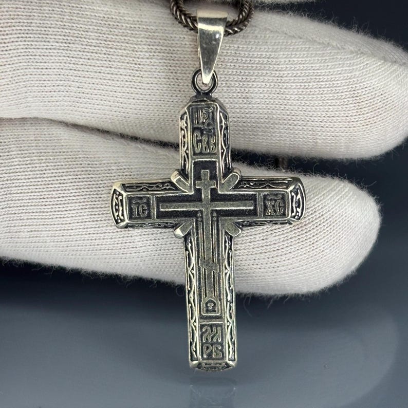 Unique Byzantine Orthodox Cross Necklace in solid 925 sterling silver, decorated with engraved Eastern Christian symbols. This artisan handmade pendant is a spiritual keepsake, perfect as a men’s religious necklace, faith jewelry, or gift for those who appreciate Orthodox heritage and Christian devotion.