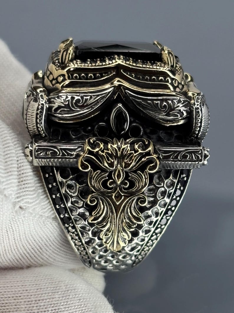 Gloved back/side view showing the Ottoman-inspired scrollwork and sturdy 925 sterling silver construction of the men’s ring.