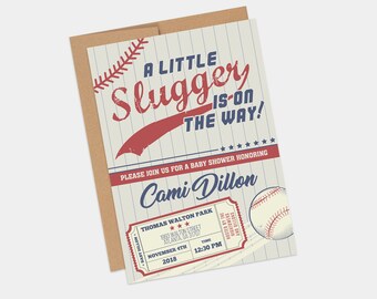 Peut inclure: Une invitation à une fête prénatale sur le thème du baseball avec un schéma de couleurs rouge, blanc et bleu. L'invitation indique "A Little Slugger is on the Way!" et comprend les détails de l'événement, y compris la date, l'heure et le lieu. L'invitation présente également un billet de baseball et un ballon de baseball.