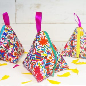 Pyramid purses with a design inspired by Mexican embroidery.