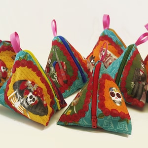 Pyramid purses with Mexican skulls.