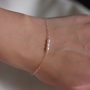 Dainty gold tiny oval pearl bracelet 1 2 3 rice pearls image 1