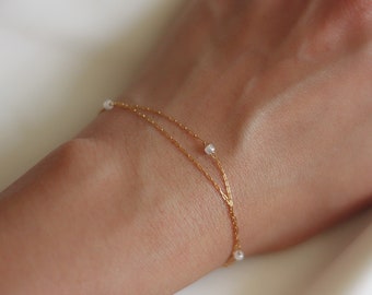 Braccialetto a strati con perle delicate