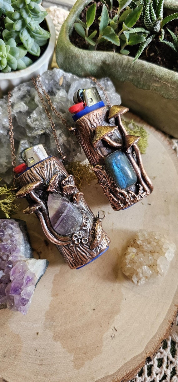 Hand-sculpted mushroom lighter sleeve necklace electroformed in copper with real crystals — functional fairy-core wearable art with 83 hearts backing it up.