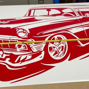 May include: Red and white silhouette of a classic car, possibly a 1950s Chevrolet, on a white background. The car is facing the left side of the image and is partially obscured by a yellow measuring tape.