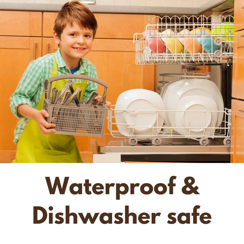 May include: A young person in a green apron loads a dishwasher with silverware in a wire basket. The dishwasher is full of clean dishes. The text "Waterproof & Dishwasher safe" is displayed below the image.