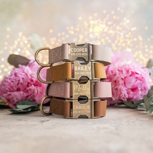 May include: Four personalized dog collars stacked on top of each other. The collars are made of leather and have gold metal buckles. The collars are engraved with the names "Cooper", "Bailey", "Molly", and "Charlie" along with phone numbers.