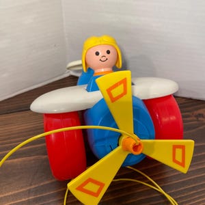 Vintage ©1980 Fisher Price® pull toy airplane with pilot #171 Made in the USA Division of The Quaker Oats company®
