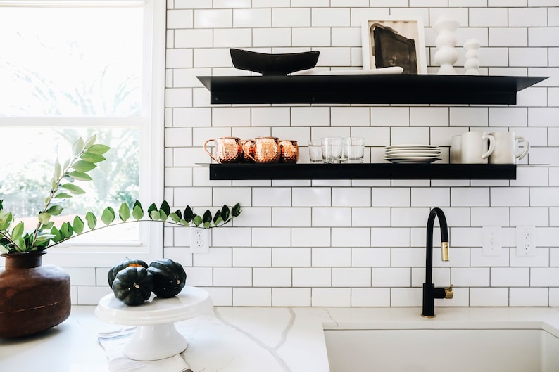 black kitchen shelving with bent metal