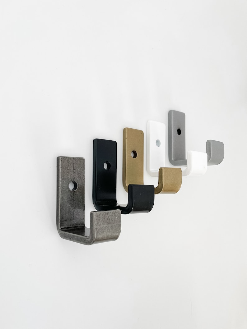 single wall hooks - raw steel, black, brass, white, and silver