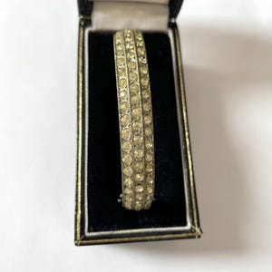 Old Vintage Antique Art Deco 3 Rows Rhinestone Silver Tone Metal Engraved Flowers Hinged Bangle From The 1940s