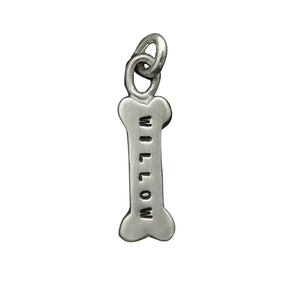 May include: Silver dog bone charm with the name "Willow" engraved on it.
