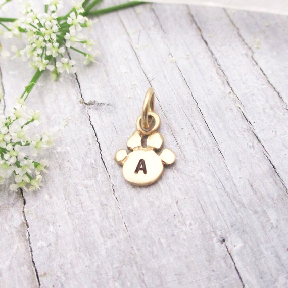 Gold paw charm deals