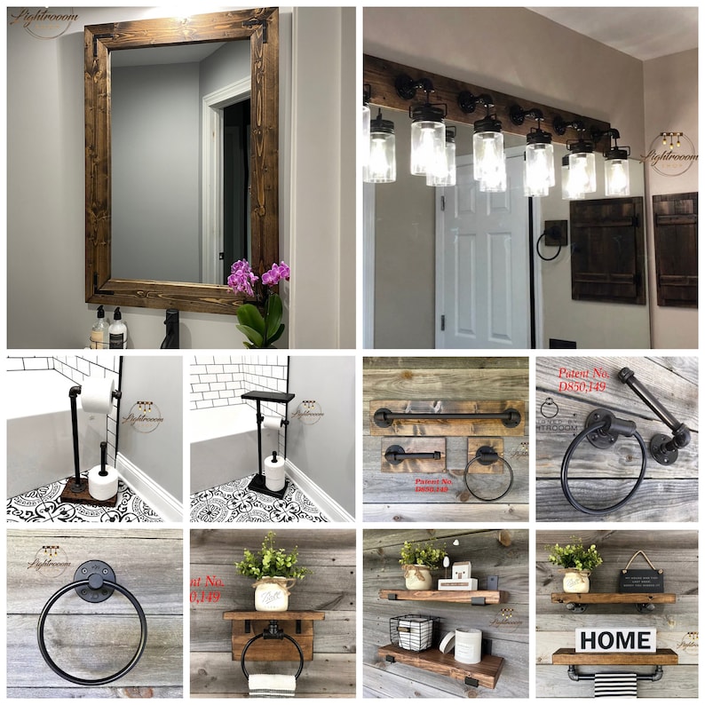 May include: A collection of rustic bathroom fixtures and decor. Includes a large framed mirror, a light fixture with glass jar shades, towel racks, shelves, and toilet paper holders. The items are made of wood and metal.