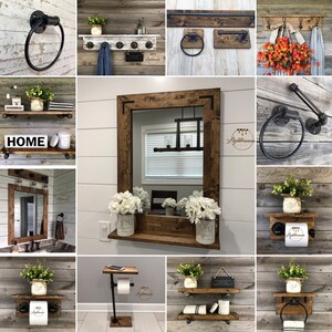 May include: A collection of rustic bathroom decor items, including towel rings, shelves, and a mirror with a wooden frame. The items are made of wood and black metal, with a farmhouse style. Some shelves have a Mason jar with greenery.