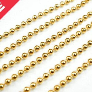 May include: Gold ball chain, a type of jewelry chain made of small, round metal balls connected by links. The chain is shown in multiple strands, highlighting its smooth, shiny surface.