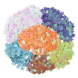May include: A collection of star-shaped sequins in various colors, including orange, purple, green, and blue. The sequins are arranged in a circular pattern, creating a vibrant and eye-catching display. Ideal for craft projects and embellishments.
