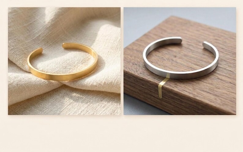 K&ouml;nnte beinhalten: Zwei offene Armreifen. Einer ist goldfarben und liegt auf einem beigen Stoff. Der andere ist silberfarben und wird auf einer Holzoberfl&auml;che pr&auml;sentiert. Beide Armreifen haben ein schlichtes, minimalistisches Design.