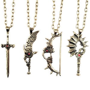 May include: Four antique gold-colored pendant necklaces with matching chains. Each pendant features a unique design: a sword, a winged blade, a bow and arrow, and a key-like shape. All pendants have red accents.