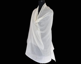 May include: A white pashmina shawl draped over a mannequin. The shawl is made of soft, lightweight fabric and has a delicate, flowing drape.