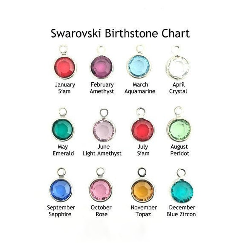 May include: A chart showing Swarovski birthstones for each month of the year. The chart features a small, round, crystal charm for each month, with the month and birthstone name listed below each charm.