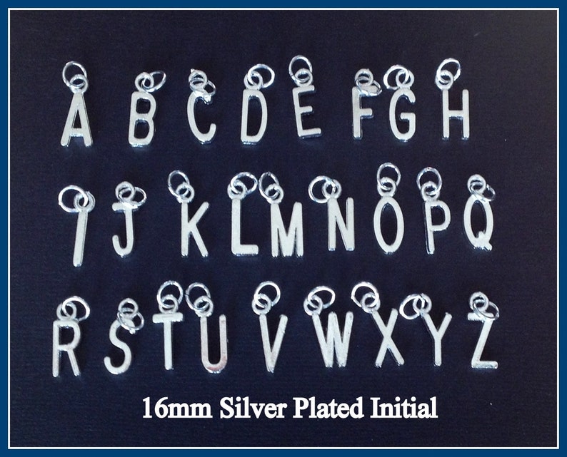 May include: Silver-plated initial charms, 16mm in size, arranged in alphabetical order from A to Z. Each letter has a small loop at the top for attaching to jewelry. The text "16mm Silver Plated Initial" is at the bottom.