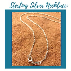 May include: A sterling silver necklace featuring a delicate twisted chain and a lobster claw clasp. The text Sterling Silver Necklace is displayed at the top of the image. The chain has a bright metallic finish and a fine link construction.