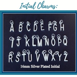 May include: A collection of silver-plated letter charms arranged in three rows, each featuring a jump ring for attachment. The text Initial Charms and 16mm Silver Plated Initial is visible. Each charm represents a letter from A to Z.