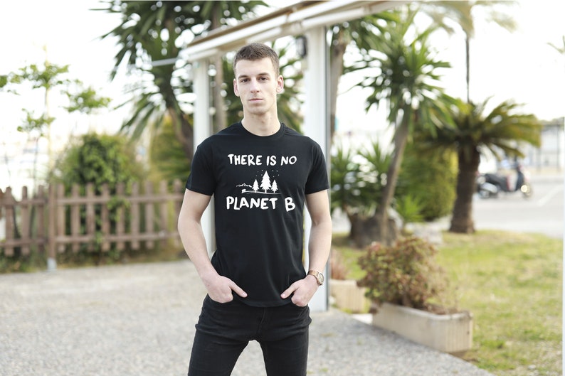 May include: A black t-shirt with a white graphic that says "There is no Planet B" with a small illustration of trees.