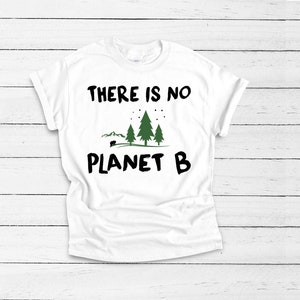 May include: White t-shirt with a black graphic that says "THERE IS NO PLANET B" with a green illustration of trees and a small black bear.