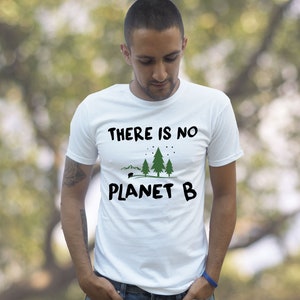 May include: A white t-shirt with the text "THERE IS NO PLANET B" and a graphic of three green trees and a small camper.
