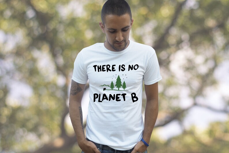 May include: A white t-shirt with the text "THERE IS NO PLANET B" and a graphic of three green trees and a small camper.
