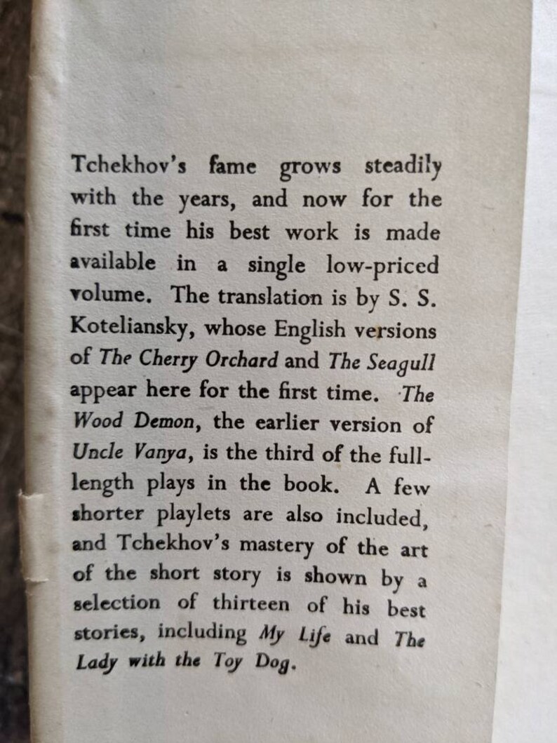 May include: A black and white book cover with the title "Tchekhov's" in large, bold font. The text describes the book as a collection of the author's best work, including plays and short stories.