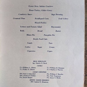 May include: A vintage menu with the word "MENU" at the top. The menu lists various dishes like Oyster Stew, Roast Turkey, and Mince Pie. It also includes names of the Mess Sergeant, Cooks, Cook's Helpers, and Dining Room Orderly.