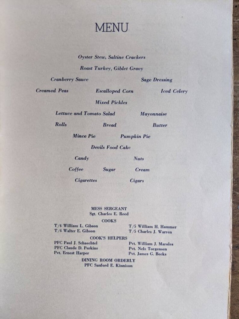 May include: A vintage menu with the word "MENU" at the top. The menu lists various dishes like Oyster Stew, Roast Turkey, and Mince Pie. It also includes names of the Mess Sergeant, Cooks, Cook's Helpers, and Dining Room Orderly.