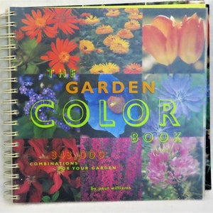 May include: The Garden Color Book cover features a colorful collage of flowers in shades of red, orange, yellow, blue, and pink. The title "The Garden Color Book" is written in green letters with a green outline. The subtitle "343,000 Combinations for Your Garden" is written in black letters. The author's name, "by Paul Williams", is written in black letters at the bottom of the cover.