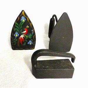 CHOICE of 3 "Sad Irons": Two Geneva Star Flat Irons Painted Black, one w Additional Folk Art Decoration, and One Black Rectangular Iron