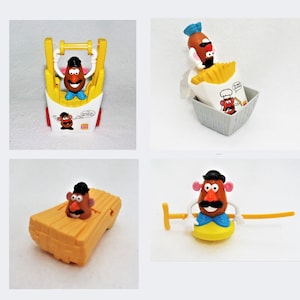 May include: Four different Mr. Potato Head toys. One is in a yellow and red french fry container, one is in a gray french fry container, one is in a yellow wooden boat, and one is on a yellow disc with a yellow stick.
