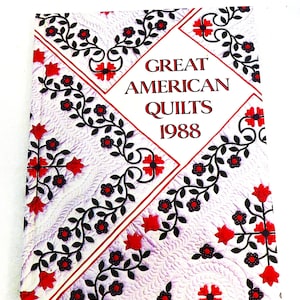 May include: A book cover with a white background and a red, black, and white floral pattern. The title "GREAT AMERICAN QUILTS 1988" is printed in red and black.
