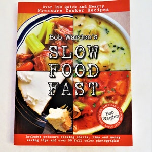 May include: A red, white, and blue cookbook titled "Bob Warden's Slow Food Fast" with a photo of four different dishes on the cover. The book includes over 120 quick and hearty pressure cooker recipes, pressure cooking charts, time and money saving tips, and over 50 full color photographs.