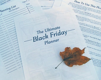 May include: A printable Black Friday planner with a title that reads "The Ultimate Black Friday Planner". The planner is a list of stores and items to buy. A brown leaf is on the page.