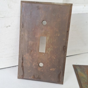 May include: A set of three ceramic mugs with a speckled, matte finish. The mugs are in shades of cream, light gray, and dark gray. Each mug has a simple, minimalist design, perfect for coffee or tea.