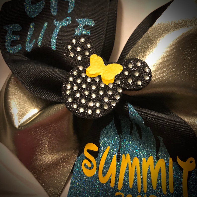 Ask me to design something for you today!! Cheer Bow Tick-Tock Bow Optional 3D Center Available SQUAD DISCOUNTS Squad Bows