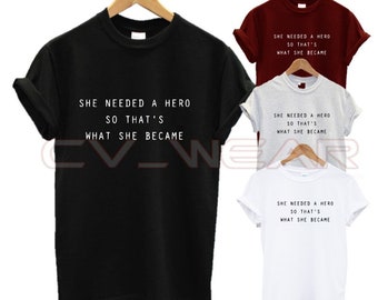 She needed a hero so thats what she became t shirt one of a kind hard work girl power love fashion slogan quote relaxed fit lose oversized