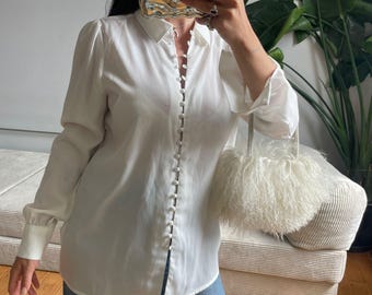 Ladies White Semi Sheer Long Sleeved button up Blous.