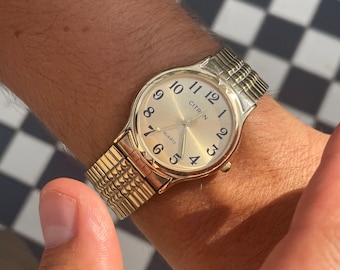 Vintage 1980s Men’s Gold Tone Stretchy Strap Analog Quartz Wristwatch By Citron