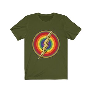 May include: A green t-shirt with a rainbow circle and a gold lightning bolt graphic.
