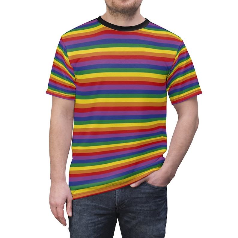 May include: A short-sleeved t-shirt with a rainbow striped pattern. The shirt has a black crew neck.